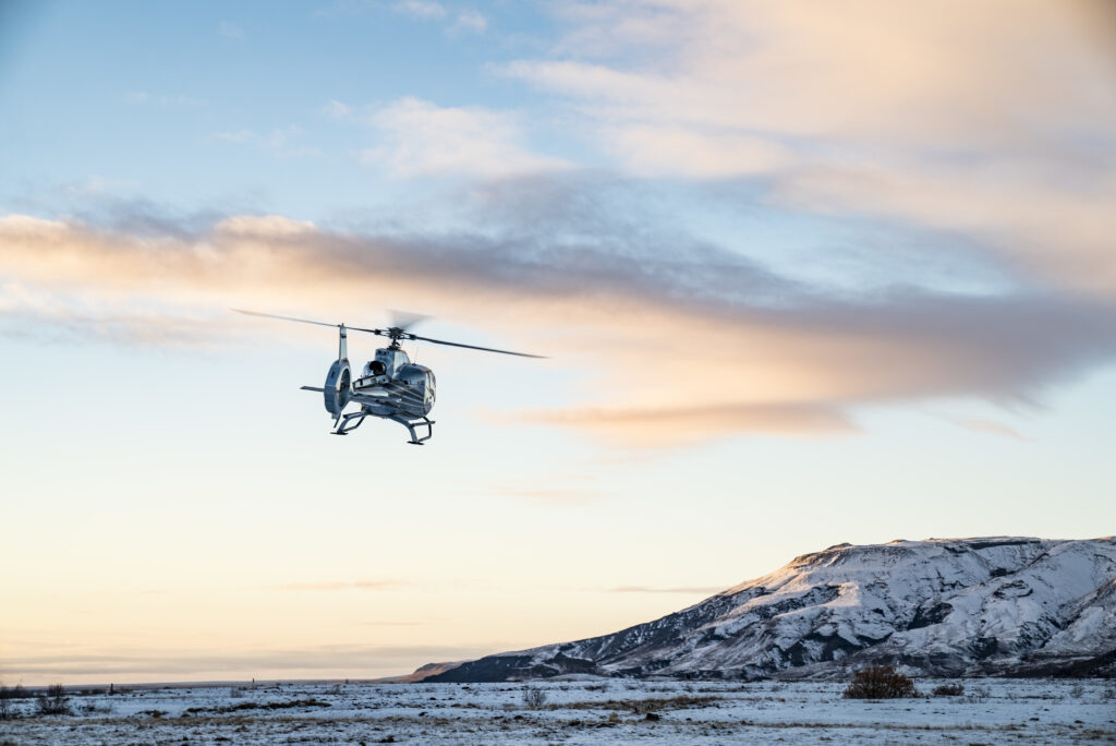 helicopter flies snow covered tundra 1